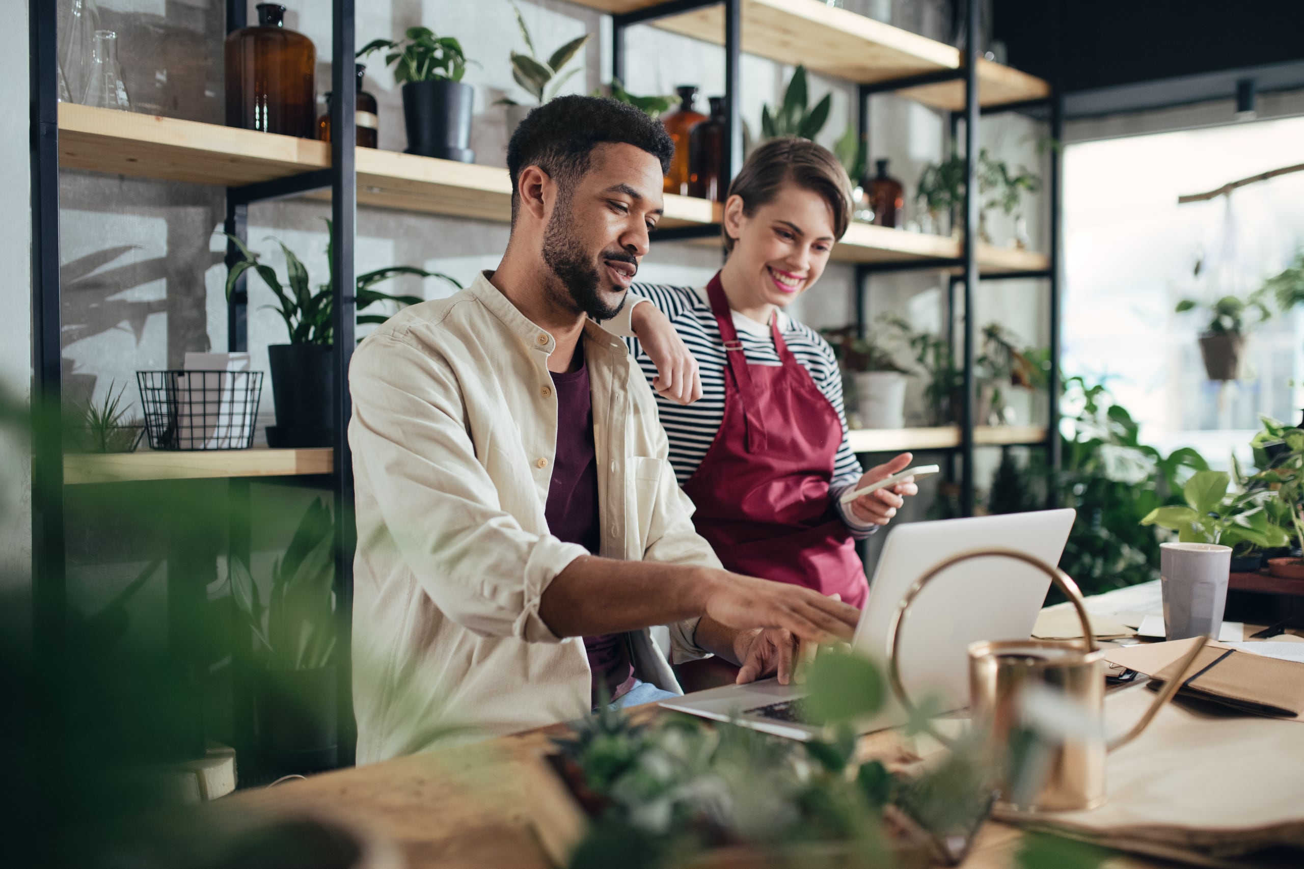 Business owners browsing the internet on a laptop